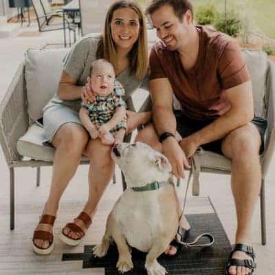 Happy family with dog enjoying outdoor time at home.